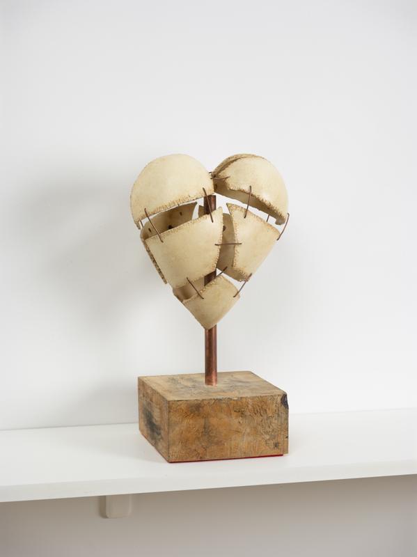 Louis Osmosis ,  Articulated Heart (Dealing with a heart that I didn’t break) , 2022. Epoxy clay, gesso, stain, hinge, magnets, copper wire, copper tubing, adhesive, spalted tamarind, felt. 9 x 6.5 x 19 inches.