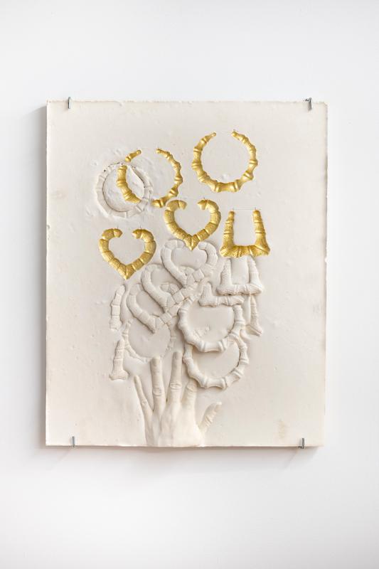 LaKela Brown , Composition with Bamboo Earrings overlapping hand , 2019. Plaster and Acrylic. 20 x 16 x 2 inches.
