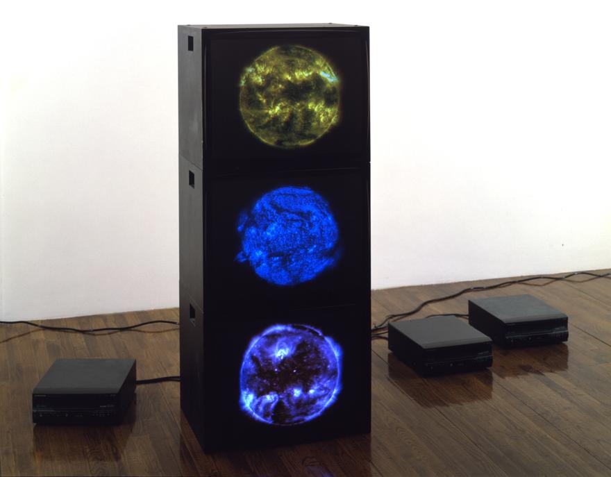 Magenta Cyan Yellow Suns , 2000 Three (3) video monitors, three (3) media players Dimensions variable  