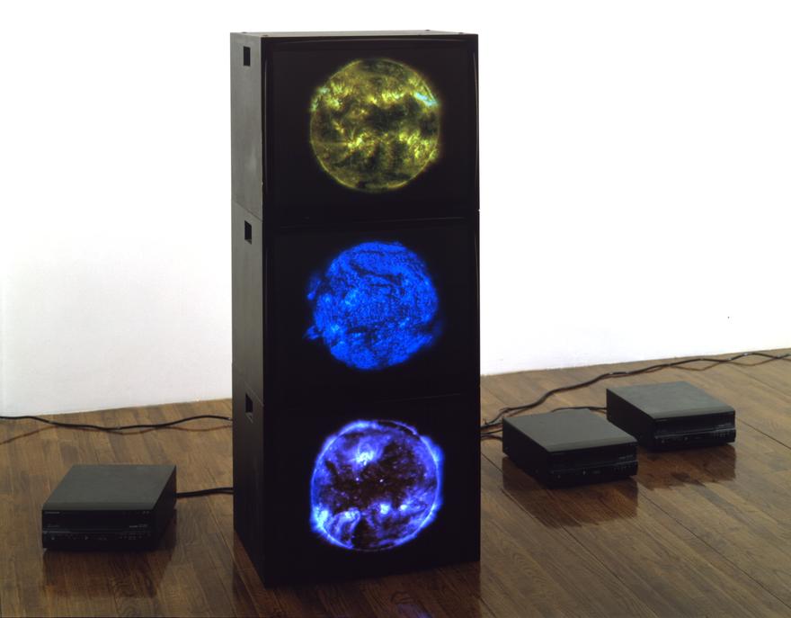 Magenta Cyan Yellow Suns , 2000 Three (3) video monitors, three (3) media players Dimensions variable  