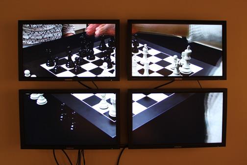 Georges Koltanowski vs. Marcel Duchamp, Paris, 1929 (Played by Ellen Simon and Cybelle Tondu),  2010 Four (4) monitors, one (1) media player, Dimensions variable  Installation view, World Chess Hall of Fame and Museum, St. Louis, Missouri, 2011 