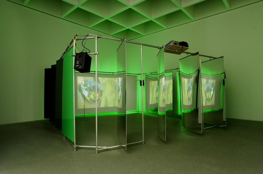 relay, 2007 One (1) media player with 5.1 Surround Encoder, one (1) LCD video projector, four (4) speakers, Plexiglas, aluminum and fluorescent tubes Installation view, Pinakothek der Moderne, Munich, Germany, 2007