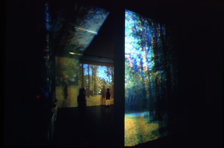 Occident Trotting , 1993 One (1) media player, four (4) video projectors Installation view, Witte de with, Rotterdam, Netherlands, 1994 