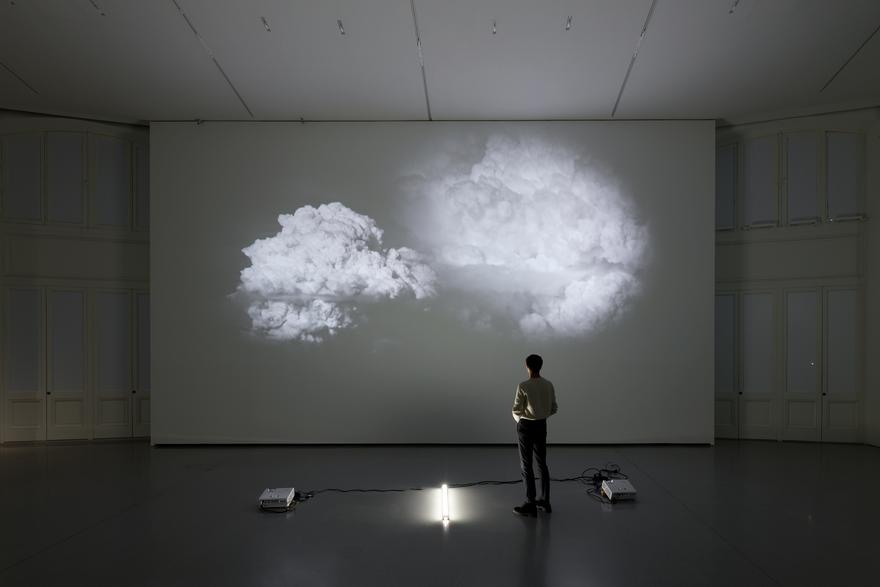 White is the Color , 2002 Two (2) video projectors, two (2) media players, one (1) lighting fixture, and existing architecture Dimensions variable Installation view, Bourse de Commerce - Pinault Collection, Paris, France, 2023 Photo by Aurélien Mole. Courtesy of Pinault Collection