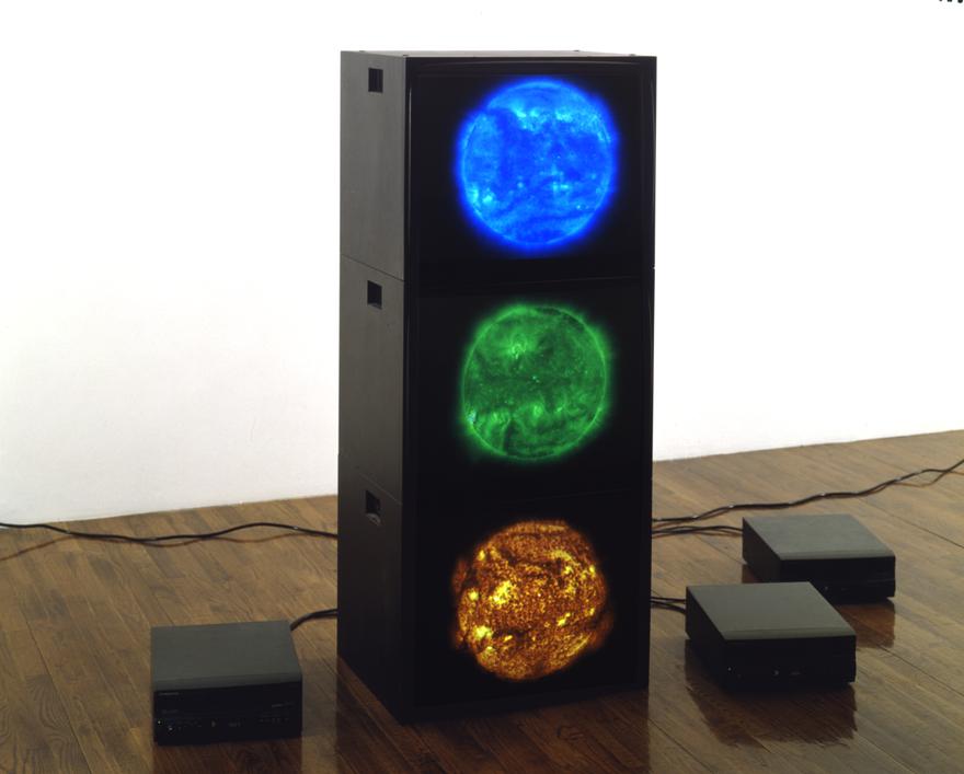 Red Green Blue Suns , 2000 Three (3) video monitors, three (3) media players Dimensions variable  