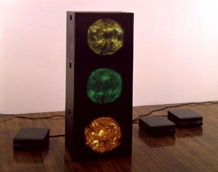 Red Green Yellow Suns , 2000 three (3) video monitors, three (3) media players Dimensions variable  