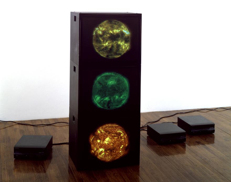 Red Green Yellow Suns , 2000 three (3) video monitors, three (3) media players Dimensions variable  